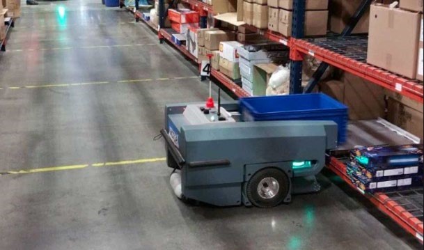 robot-delivering-tote-to-warehouse-shelf-robotics