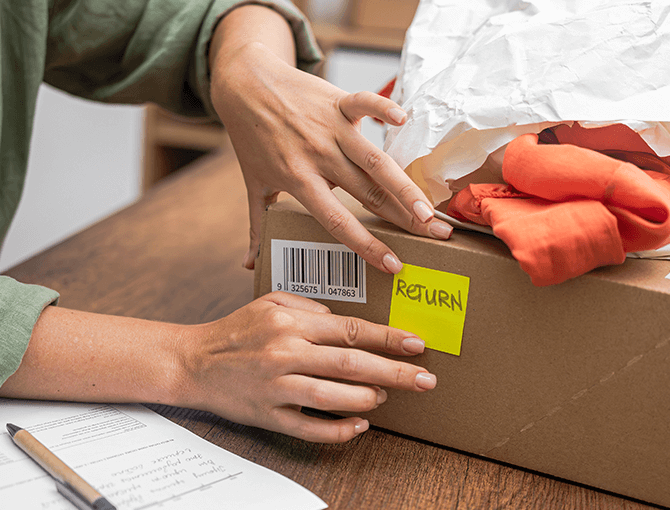 customer-applying-return-label-on-package