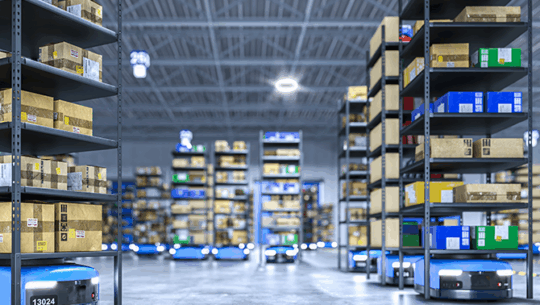 Automated guided vehicles (AGVs) transporting product through warehouse - FORTNA