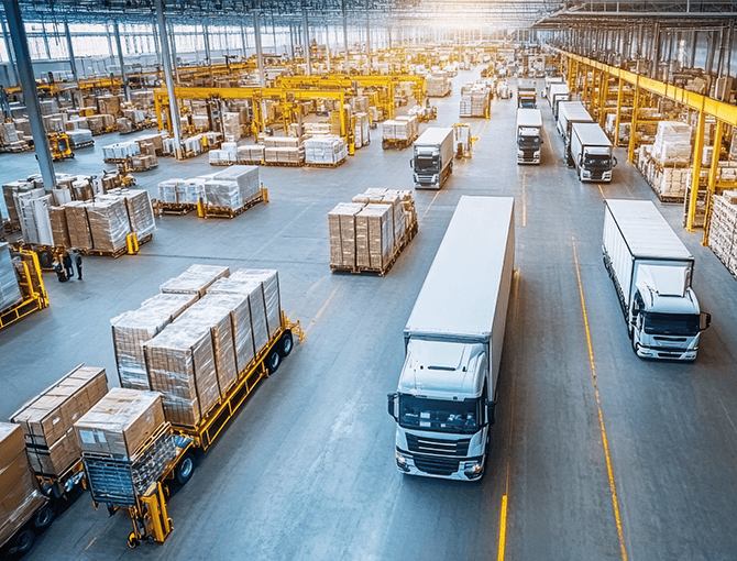 Warehouse distribution showing fork lifts, pallets, trucks - logistics | FORTNA