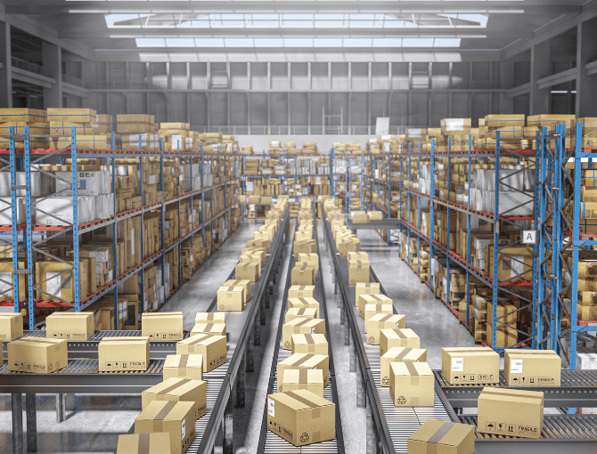 Cardboard boxes moving on multiple conveyor for peak distribution | FORTNA