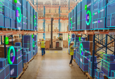 Warehouse workers managing inventory with AI optimization overlays showing on boxes | FORTNA